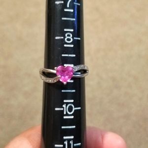 Sterling silver pink sapphire with small diamond ring.